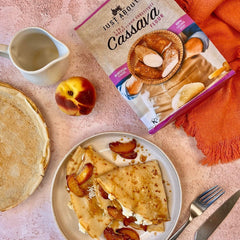 Peach & mascarpone crepes with caramelized peaches and honey drizzle on a plate