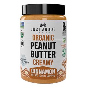 creamy peanut butter with cinnamon in jar by Just About Foods